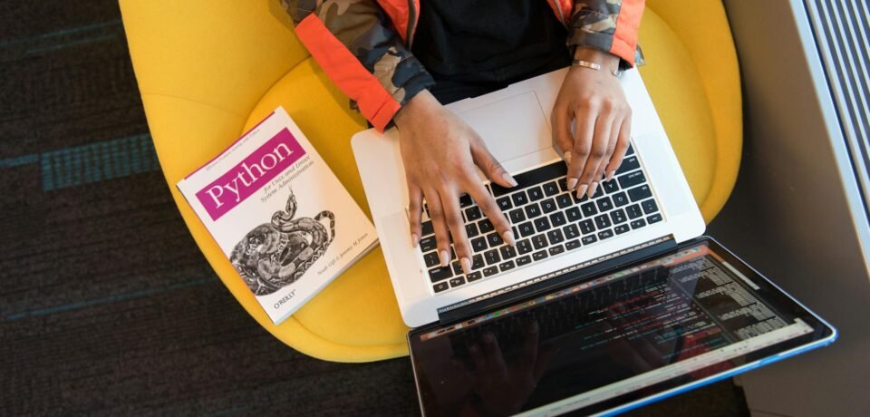 woman programming on a notebook